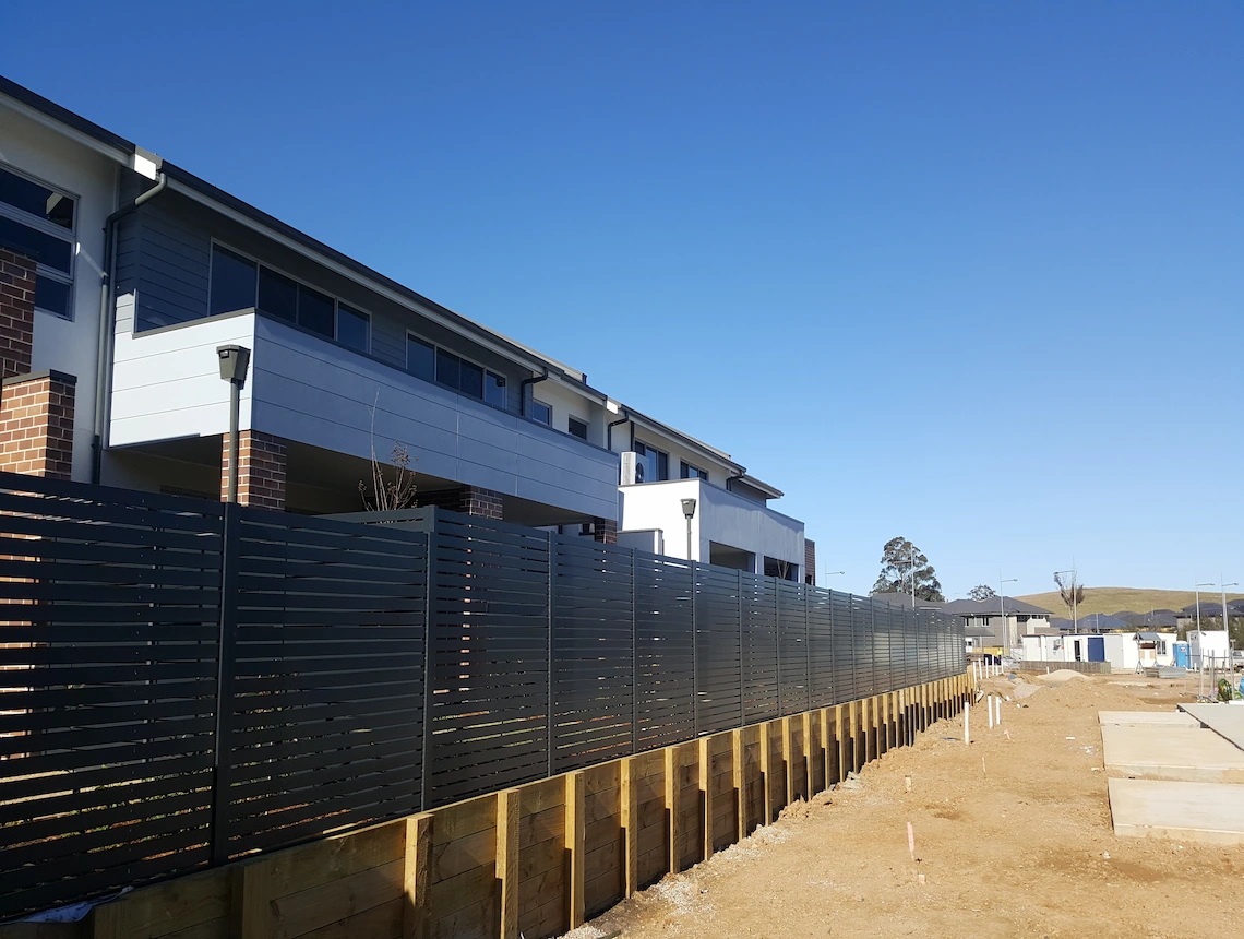 a fence next to a building