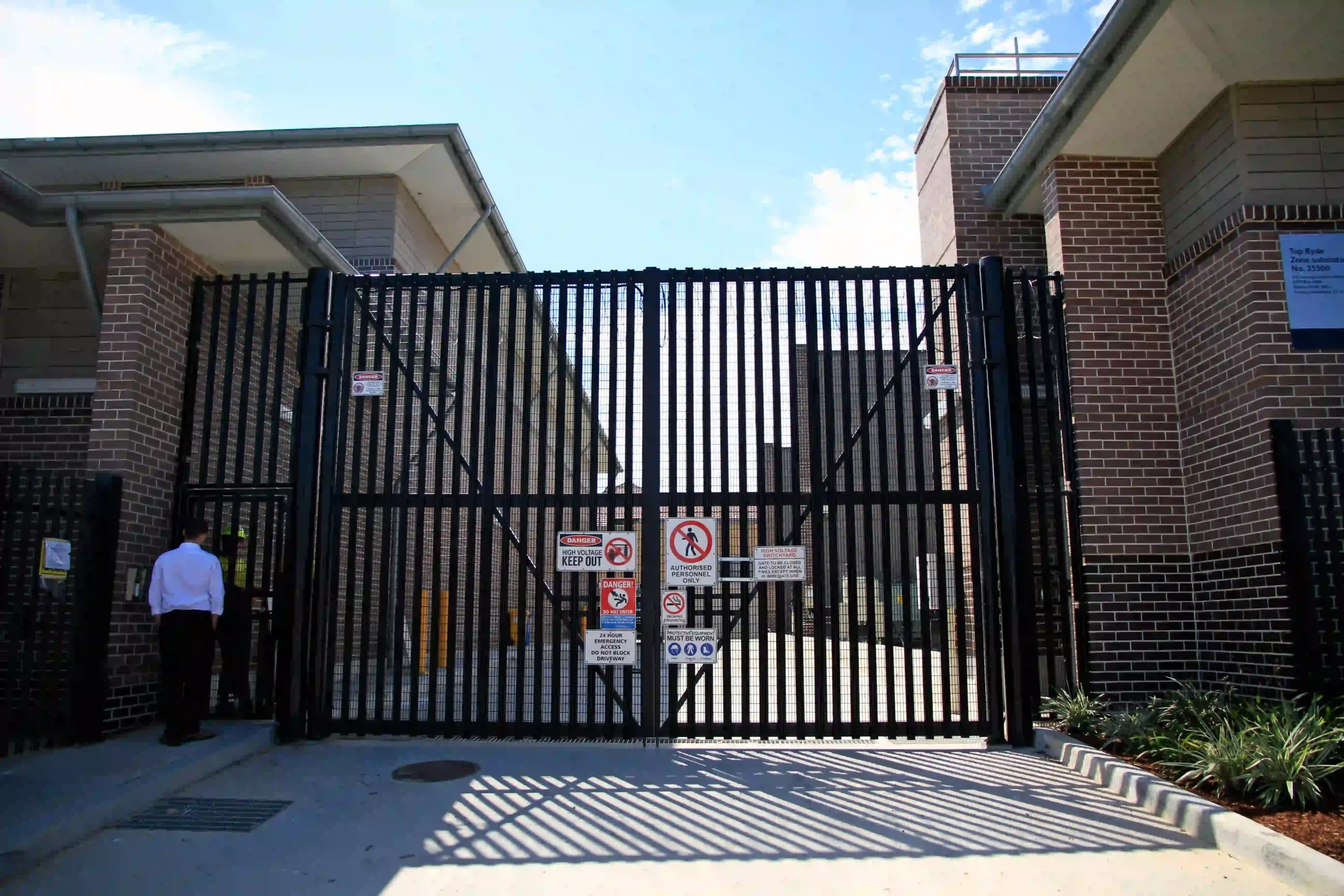 a gate with signs on it