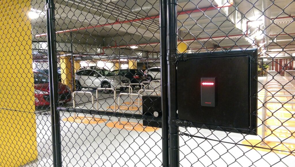 lock installed in a chainwire fence gate in a underground carpark